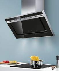 Des professionnels en nettoyage de hottes. 